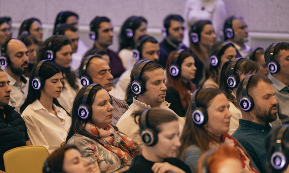 Group of professionals attending a corporate breathwork and wellness session facilitated by The Reconnected Land